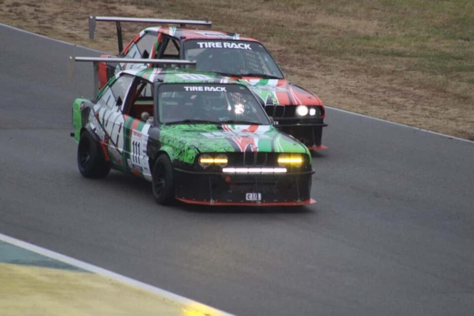 green and Orange car on track green and Orange car on track